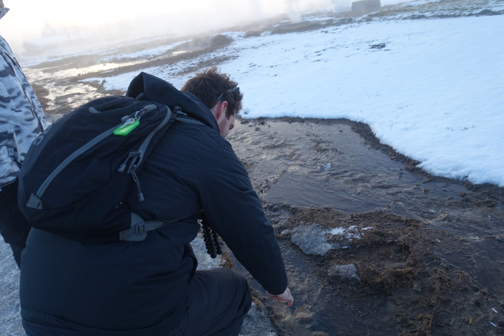 I stick my finger in some geothermal water