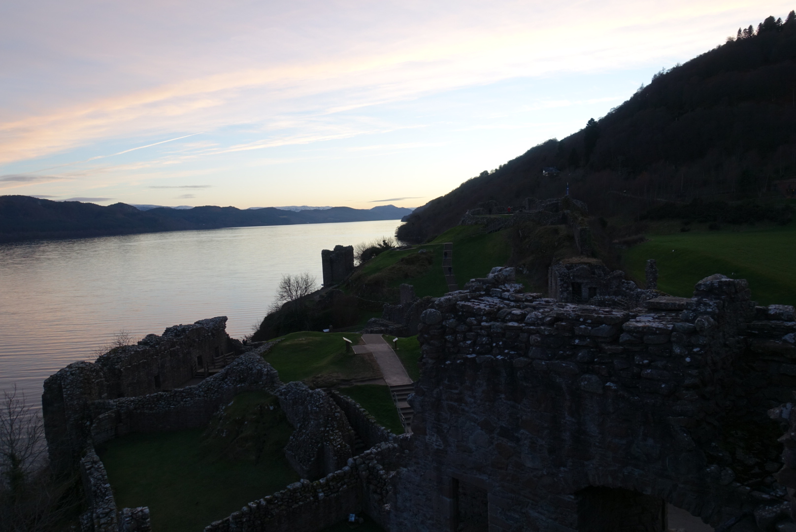 castle urquhart, craggy and ruined, at sunset